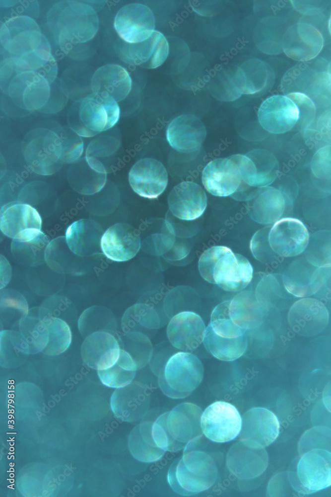 Blurry image of blue lights, vertical view. Abstract backdrop, blue colors. Blurry image of blue lights, vertical view. Abstract backdrop, blue colors.