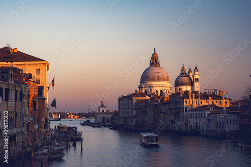 view of the Canal Grand and Basilica of Santa Maria della Salute from the Accademia bridge during covid 19 at sunset  © Emanuele