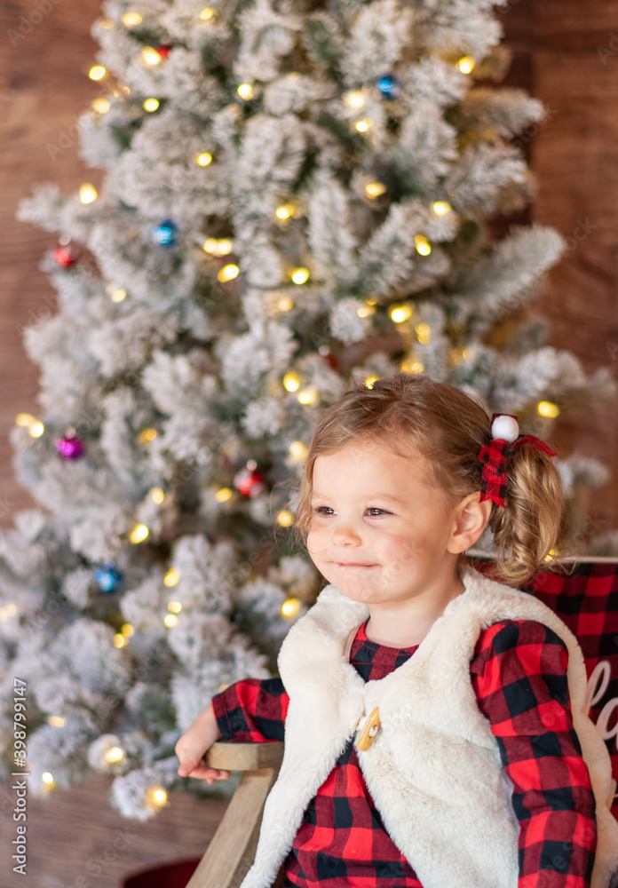 Christmas portrait of cute little girl with pigtails