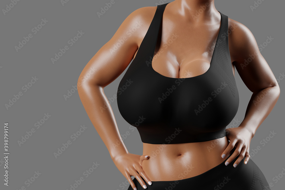 Young slim woman with big breasts in black sportswear Young slim woman with big breasts in black sportswear