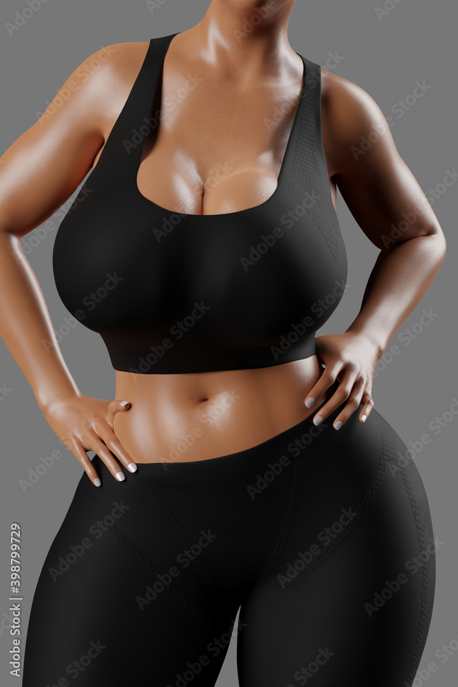 Young slim woman with big breasts in black sportswear Young slim woman with big breasts in black sportswear