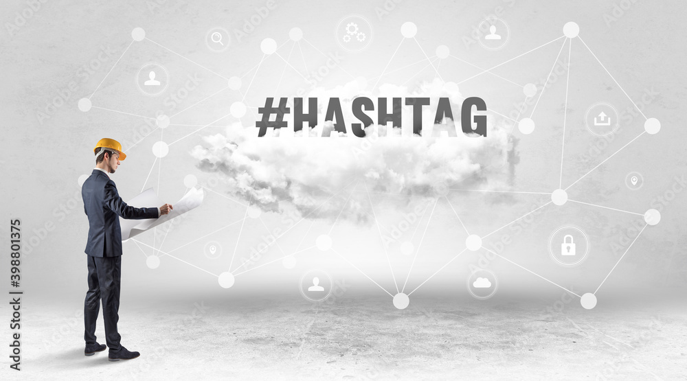 Engineer working on a social media concept with #HASHTAG inscription Engineer working on a social media concept with #HASHTAG inscription