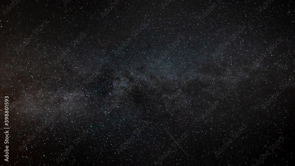 A meteorite explodes into stardust during a timelapse of a meteor shower with the Milky Way galaxy in the background.