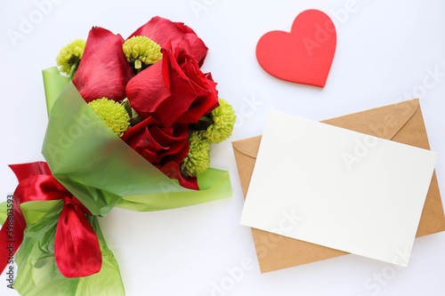 Happy Valentine's Day greeting card. beautiful bouquet of flowers, red heart and space for text