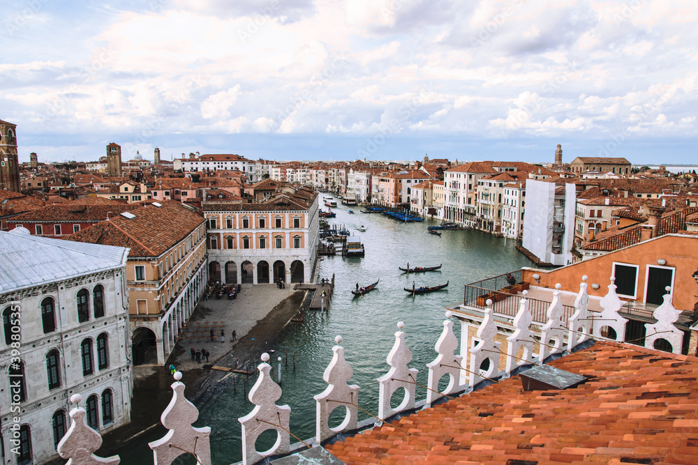 
panorama from above of the city of Venice where you can see the canals navigated by the gondolas and a detail of the Rialto Bridge. The architecture and structure of the city is unique