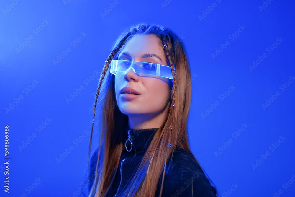 Neon portrait of a young woman in stylish glasses.