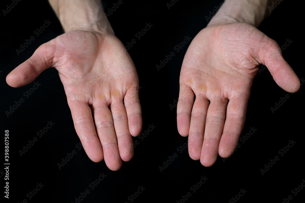 open male hands, palms close up on black background, isolated image, sign language concept, emotion symbol