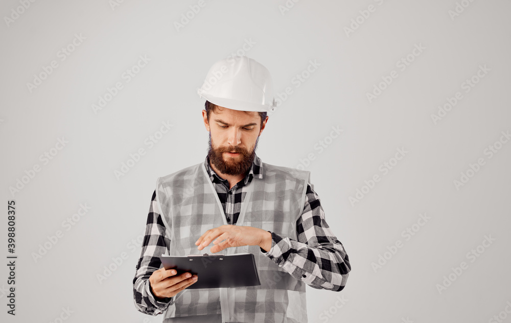 Worker man white hard hat documents construction checking work Worker man white hard hat documents construction checking work