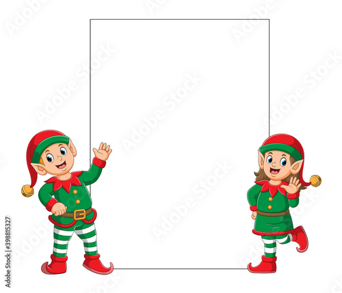 The two elfs using the Santa clause clown costume standing near the blank board