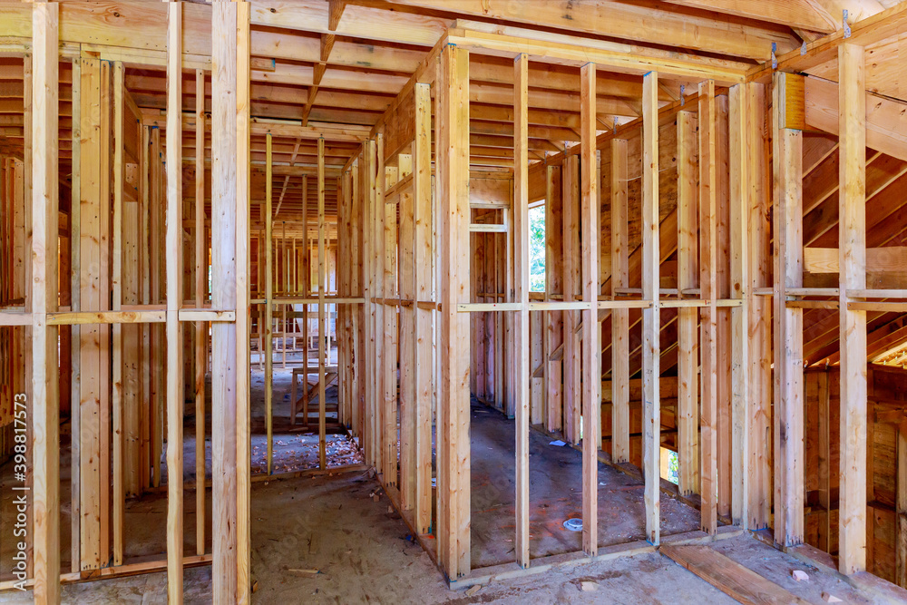 Wooden house roof frame structure on a new development Wooden house roof frame structure on a new development