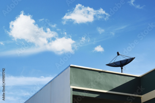 Satellite dishes on the roof of the building