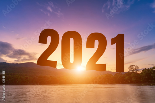 Happy New Year Numbers 2021, landscape lake views at Silhouette the hill early in nature forest Mountain views with evening blue dramatic sunset sky background, Happy new year concept.