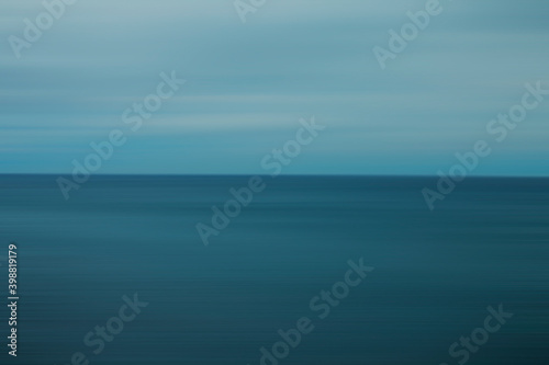 smooth blurred blue background of soft sky and water beach 