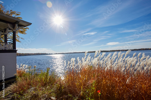 Morning sunrise over vivid blue lake on a fall day near Minneapolis Minnesota photo