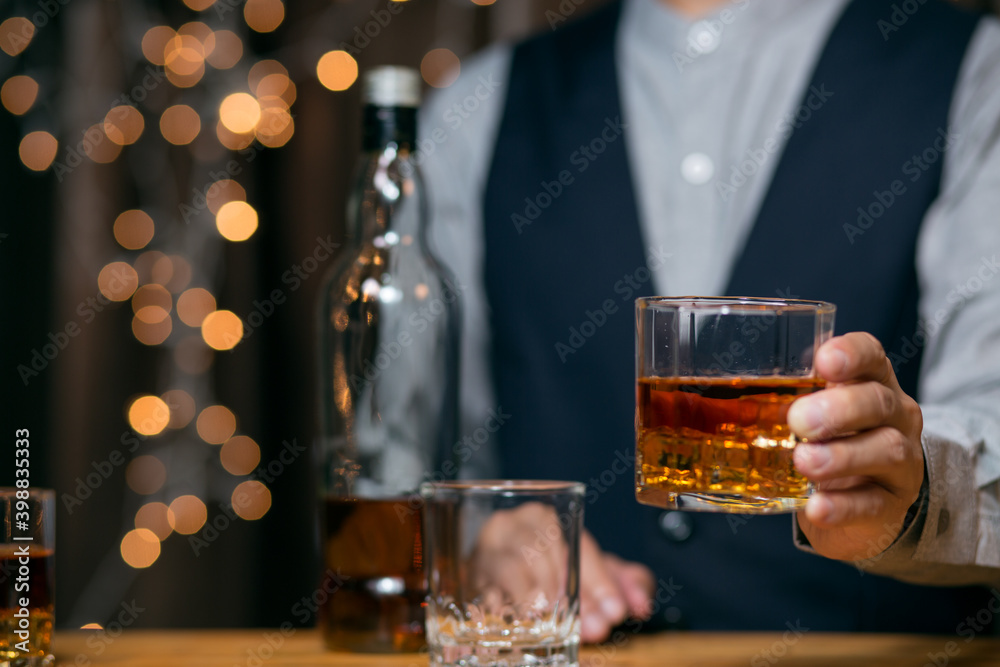 Barman pouring whiskey whiskey glass