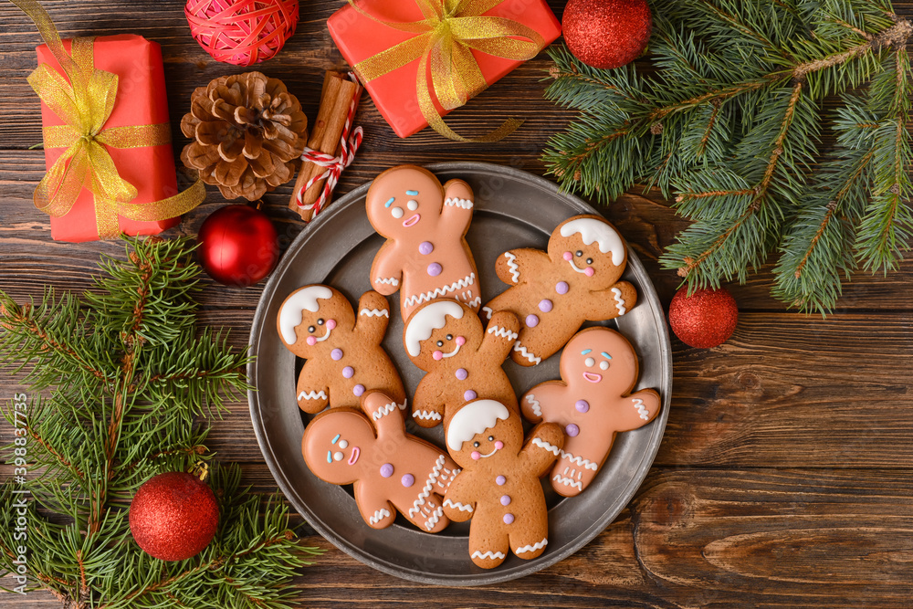 Christmas composition with gingerbread cookies on wooden background