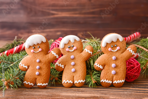 Christmas composition with gingerbread cookies on wooden background