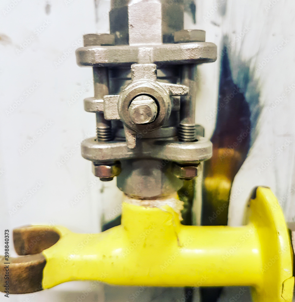 Detail small stopcocks for liquids with the yellow handle Detail small stopcocks for liquids with the yellow handle