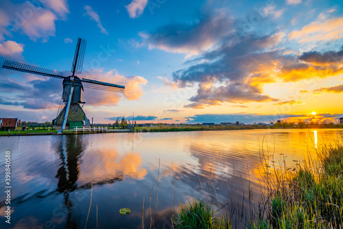 Traditional dutch windmill at sunset at Kinderdijk