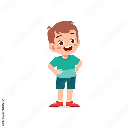 cute little kid boy stand smile with arm on hip pose expression