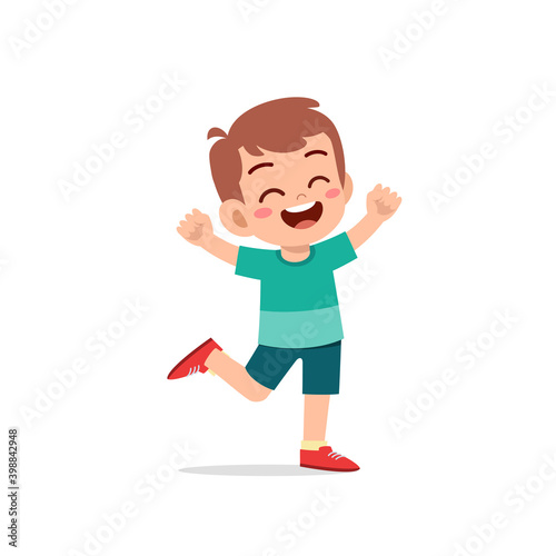 cute little kid boy stand happy celebrating pose expression