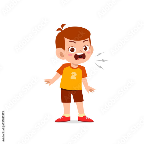 cute little kid boy stand and show angry pose expression