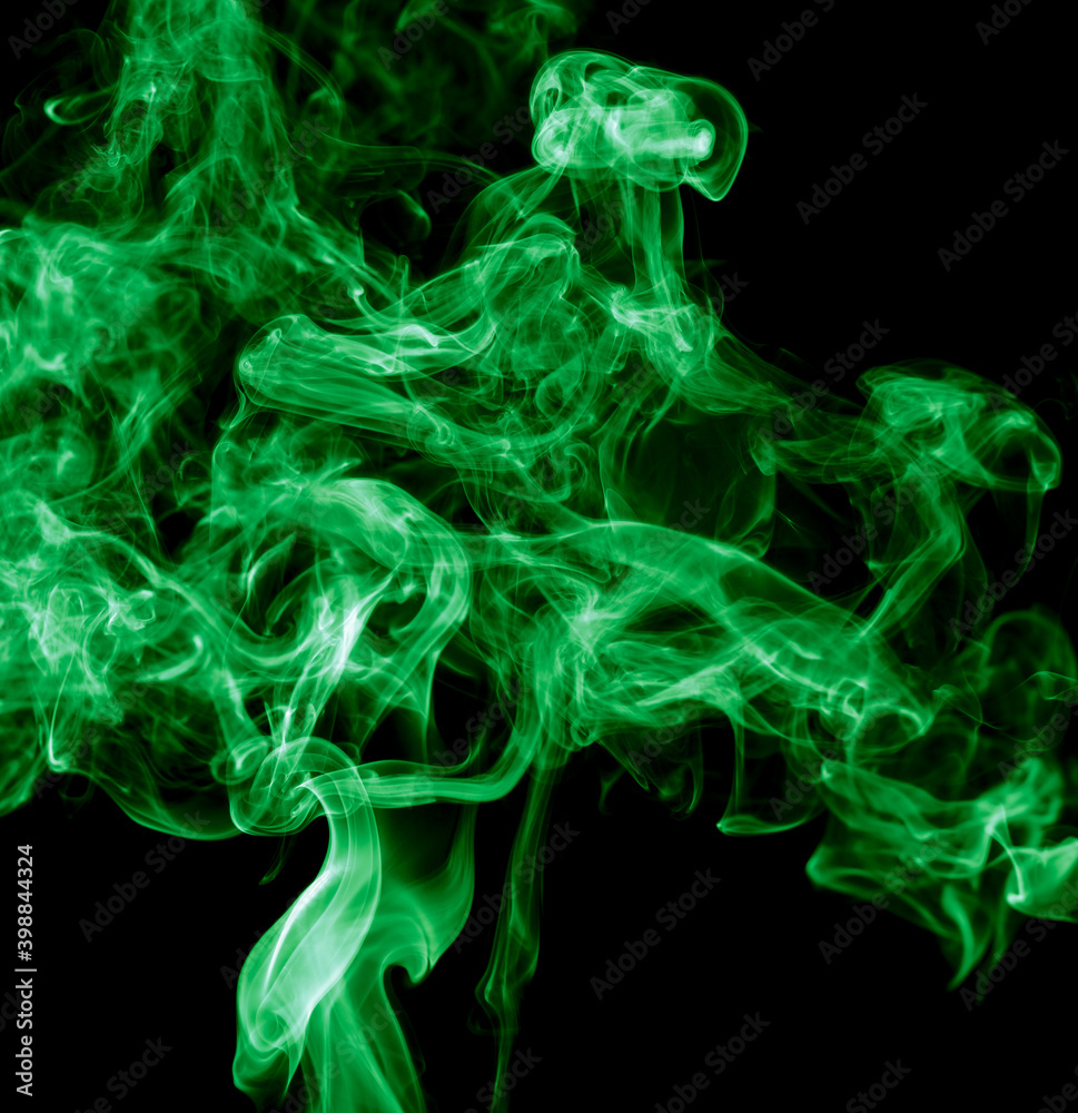 Green smoke isolated on black background. Abstraction