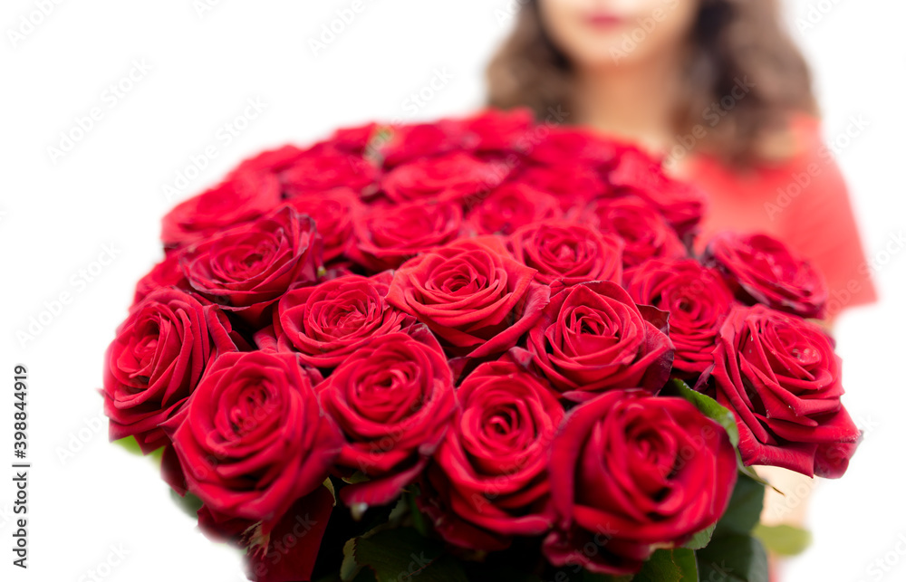 Girl with a bouquet of red roses isolated on a white Girl with a bouquet of red roses isolated on a white