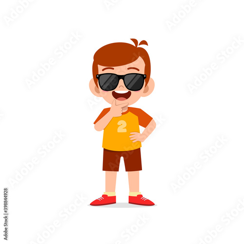 cute little kid boy show cool and wearing black glasses pose expression