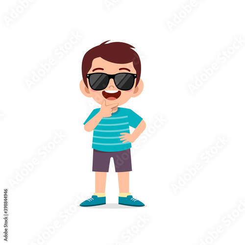 cute little kid boy show cool and wearing black glasses pose expression