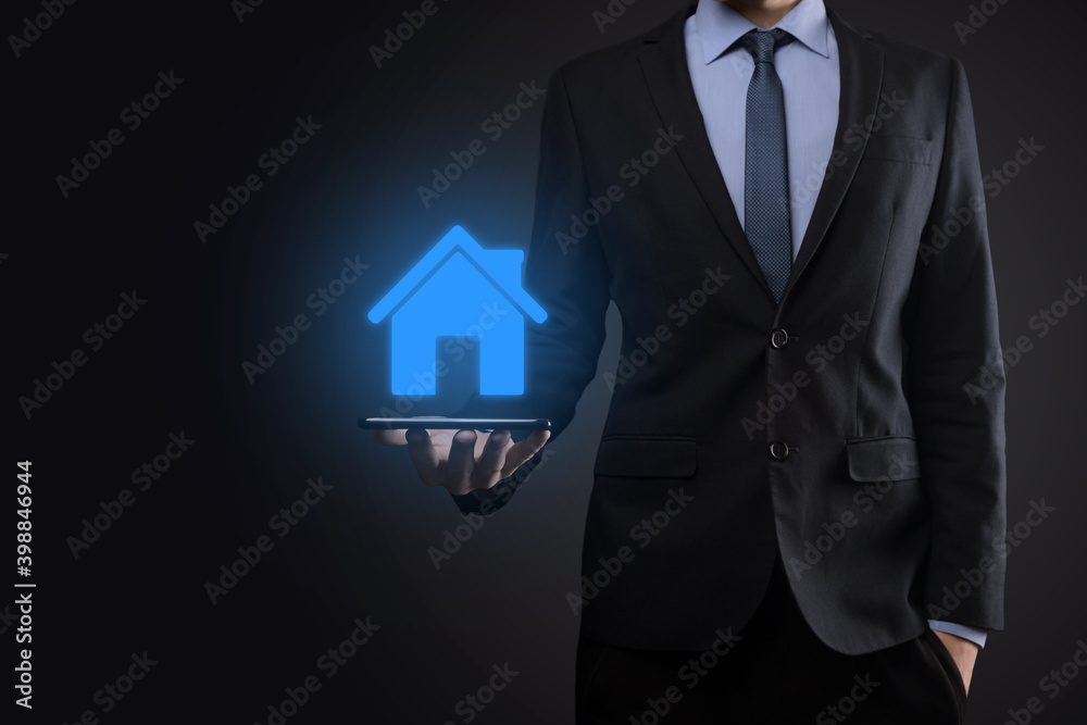 Real estate concept, businessman holding a house icon.House on Hand.Property insurance and security concept. Protecting gesture of man and symbol of house. Real estate concept, businessman holding a house icon.House on Hand.Property insurance and security concept. Protecting gesture of man and symbol of house.