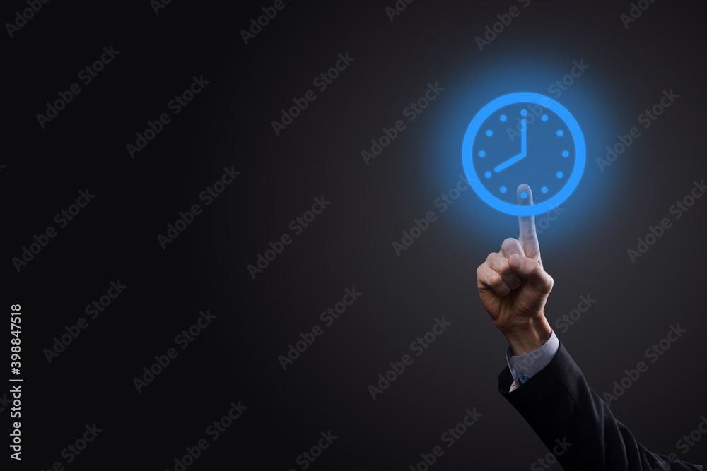 Businessman hand holds the icon of hours clock with arrow. Rapid execution of the work.Business time management and business time is money concepts Businessman hand holds the icon of hours clock with arrow. Rapid execution of the work.Business time management and business time is money concepts