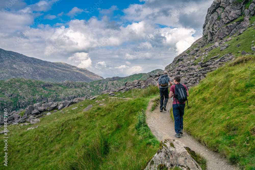 Tourist hiking mountains in Snowdonia, North Wales 