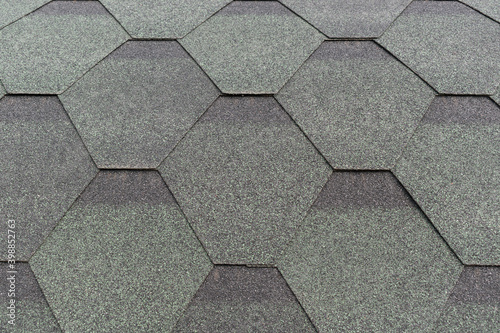 Flexible roofing material. Hexagonal shapes. Color - green, gray. Roof surface concept.