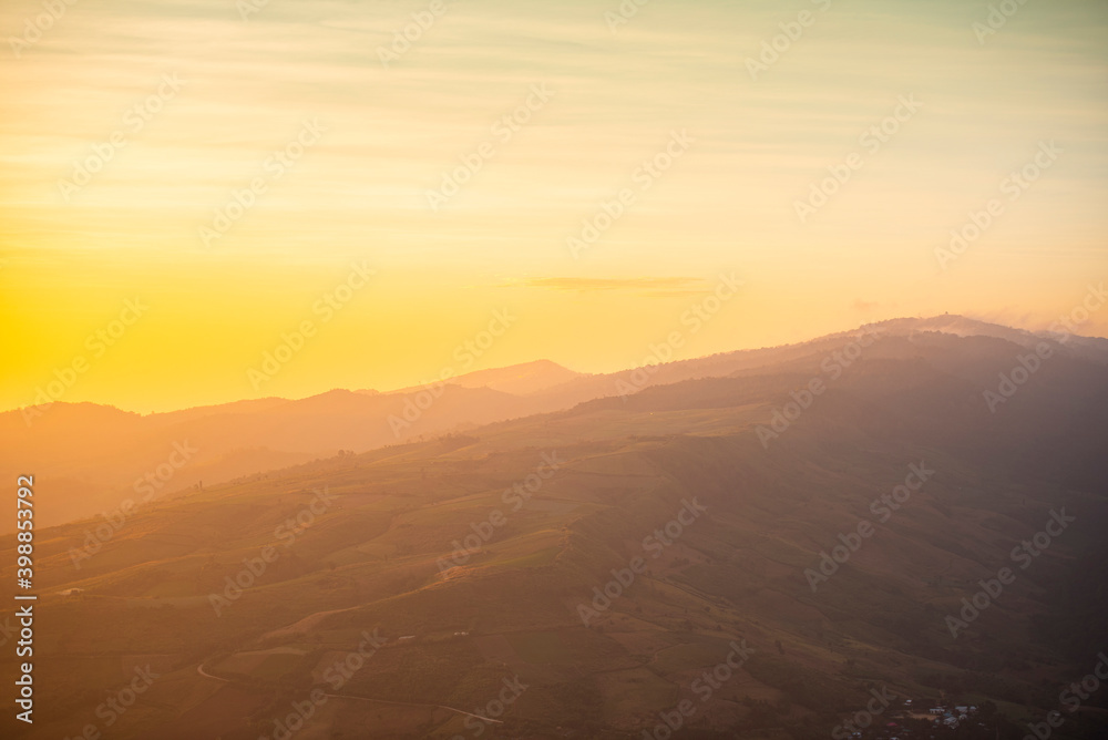 Landscape sunrise on the mountain with field and grass meadow beautiful sky yellow or sunset. Landscape sunrise on the mountain with field and grass meadow beautiful sky yellow or sunset.