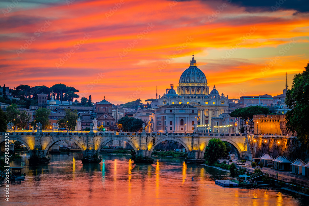 Fototapeta premium Sunset view of old Sant' Angelo Bridge and St. Peter's cathedral in Vatican City, Rome.Italy