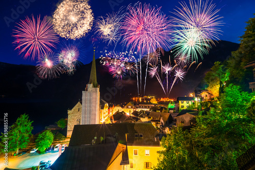 Hallstatt in Austria celebrating New Years Eve with flashing colorful fireworks