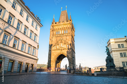 Tower of Charles Bridge with the statue of Charles IV in Prague. Czech Republic 