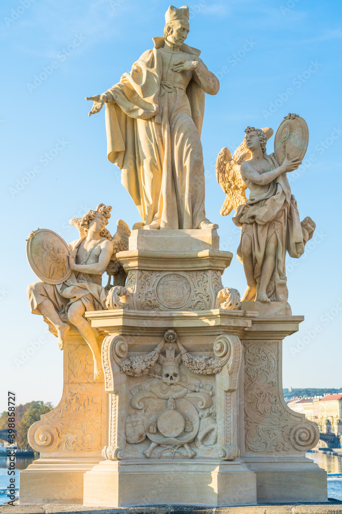 Christian stone sculpture on the Charles bridge in Prague, Czech Republic