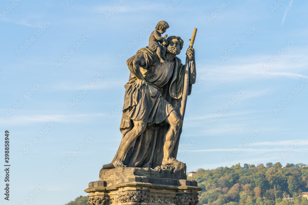 Naklejka premium Statue of Child Christus at the shoulder of saint Christopher, Charles Bridge, Prague