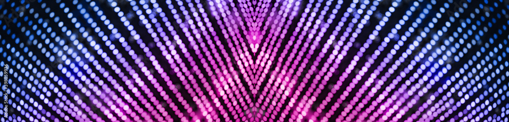 Colorful background with natural bokeh texture and defocused sparkling lights pattern. Blue and pink violet blur background with twinkling lights. Festive multi-colored lilac overlay colors banner