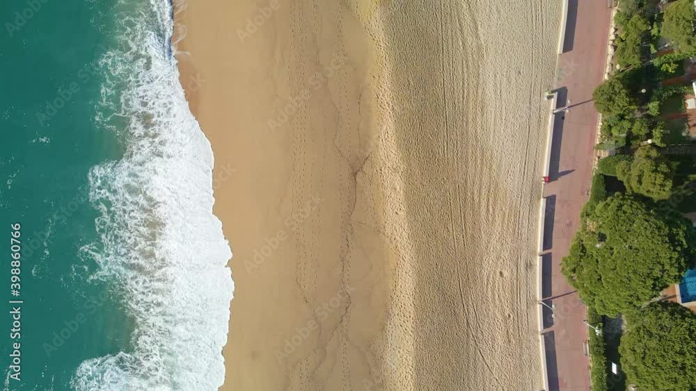 aerial image with drone of lloret de mar virgin beach with green vegetation in mediterranean sea turquoise water overhead view aerial image with drone of lloret de mar virgin beach with green vegetation in mediterranean sea turquoise water overhead view