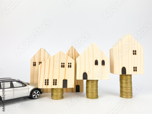 Business, Money, Finance  Concept
Model house coins stack,  money saving.Stack of money coin for saving for home, property with Wealth and saving plan for house mortgage. Personal investment concept.
