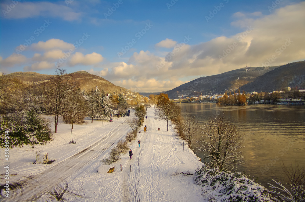 Winter with snow in old downtown, castle and main city bridge in Heidelberg, Germany, with blue cloudy sky and sunny day. Winter with snow in old downtown, castle and main city bridge in Heidelberg, Germany, with blue cloudy sky and sunny day.