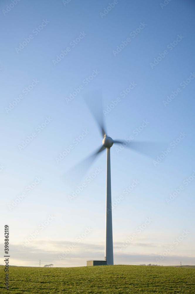 Fototapeta premium Wind Turbine and clear blue sky in Ayrshire Scotland