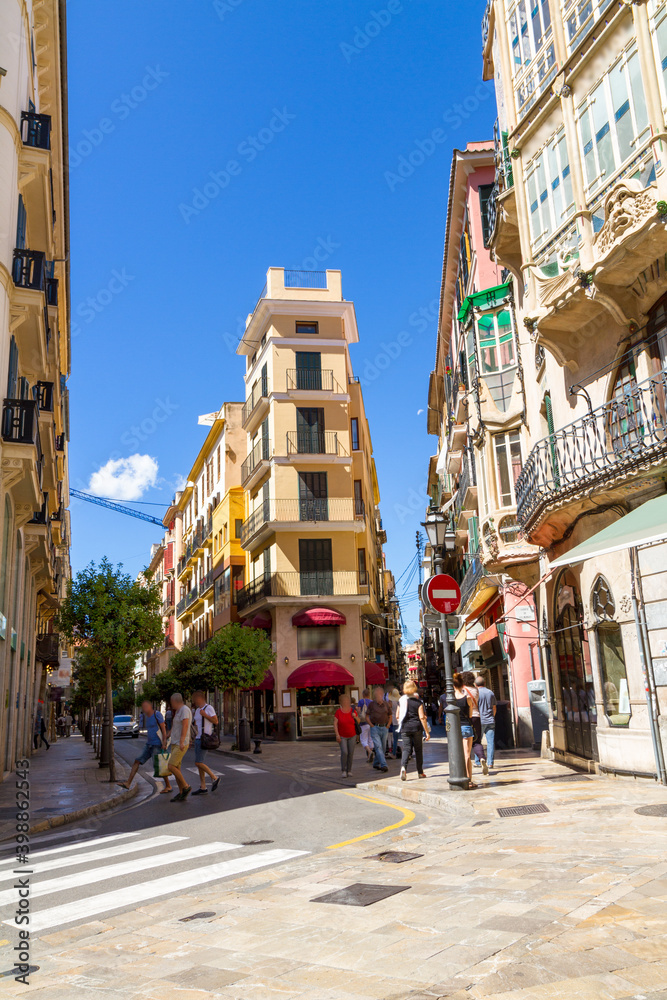 Unrecognized people walking at Palma Mallorca famous Carrer de Jaume II street in the city s historical center.