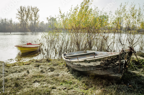Novi Sad, Serbia - November 15. 2020: A forgotten fishing boat in the tributary of the Danube near Novi Sad, Serbia 