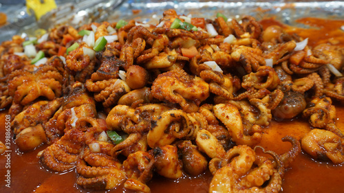 Close up Fried squid with Korean spicy sauce