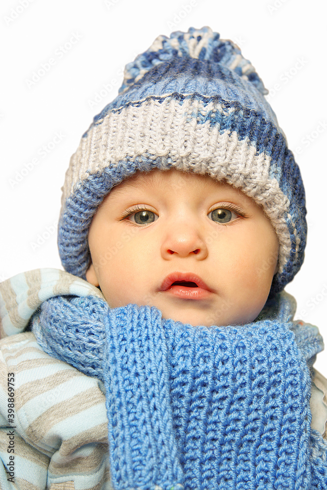 close-up portrait of cute toddler in winter clothes on white isolated background close-up portrait of cute toddler in winter clothes on white isolated background