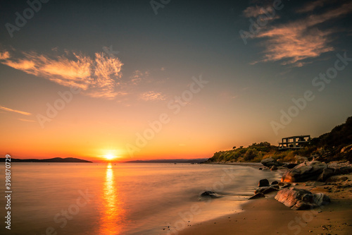 Beach in Greece, bay in the sunset, holidays by the sea, romantic